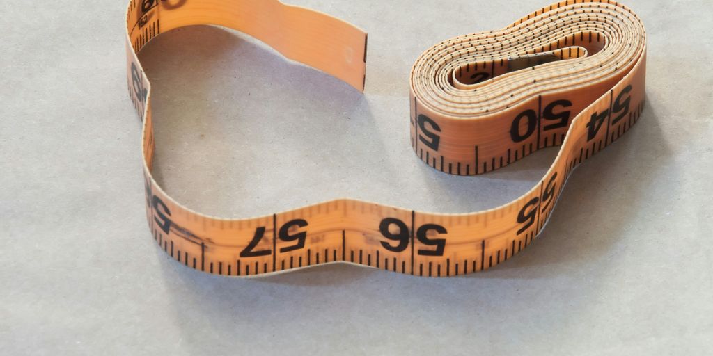 brown leather strap on white table