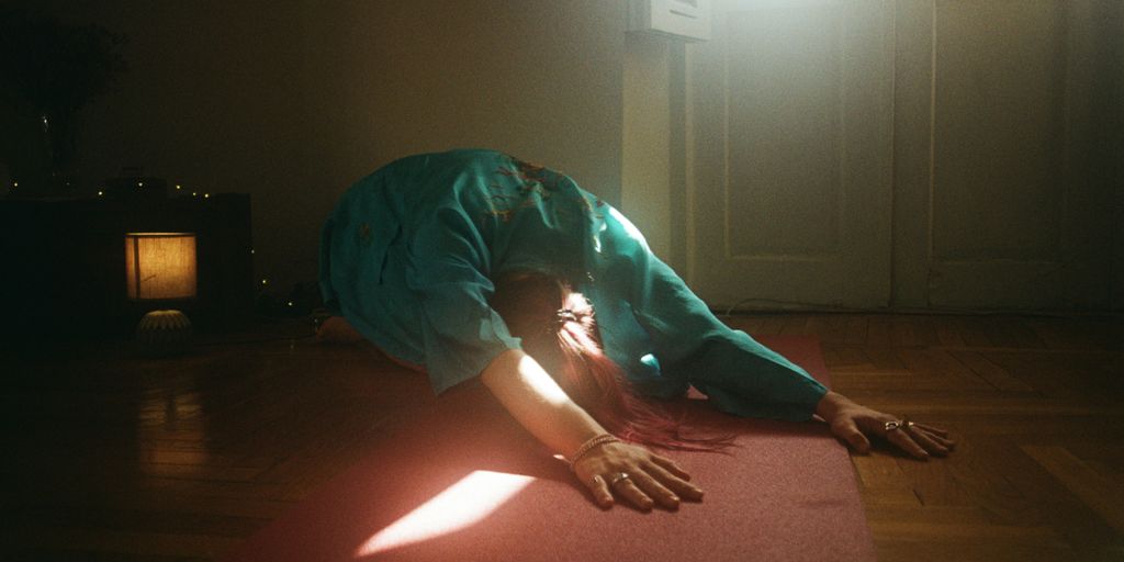 A person laying on the floor in a room