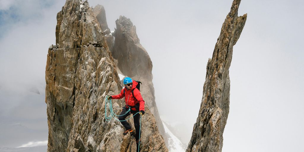 a person climbing a rock