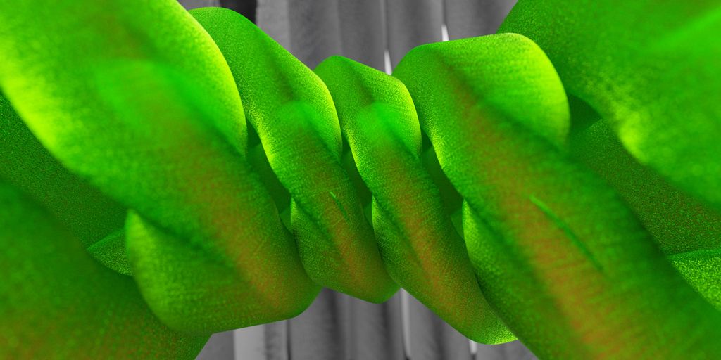 a close up of a green tie on a curtain