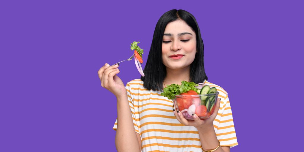 a woman holding a bowl of fruit
