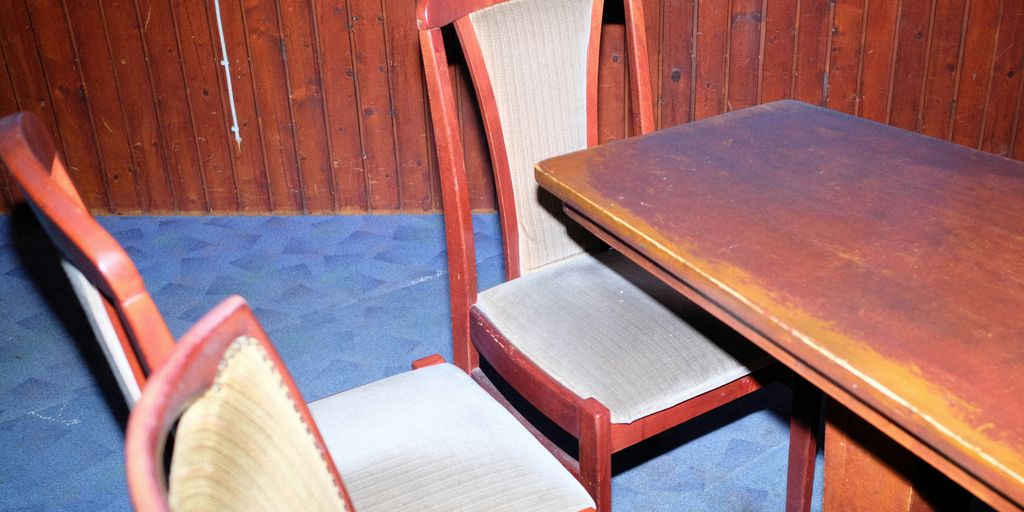 two chairs and a table in a room