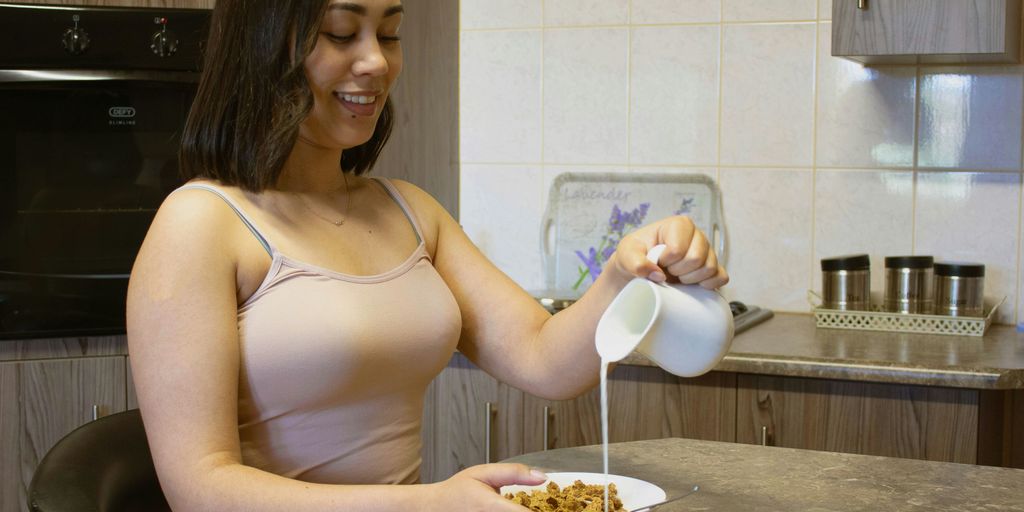 a woman eating cereal