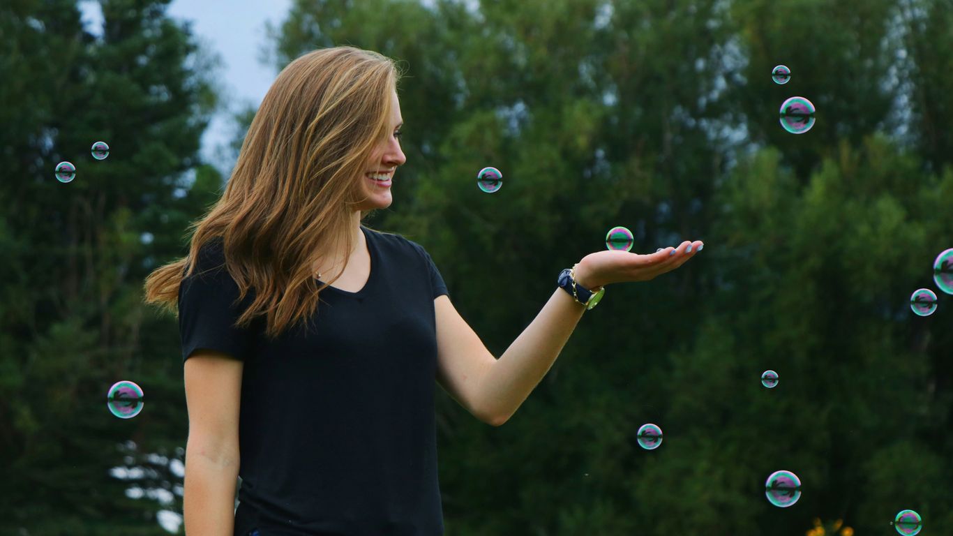 woman standing in front of bubbles
