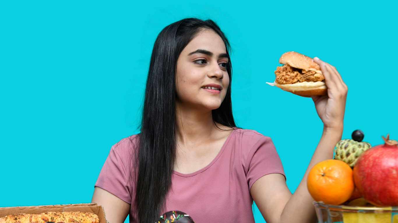 a woman holding a sandwich