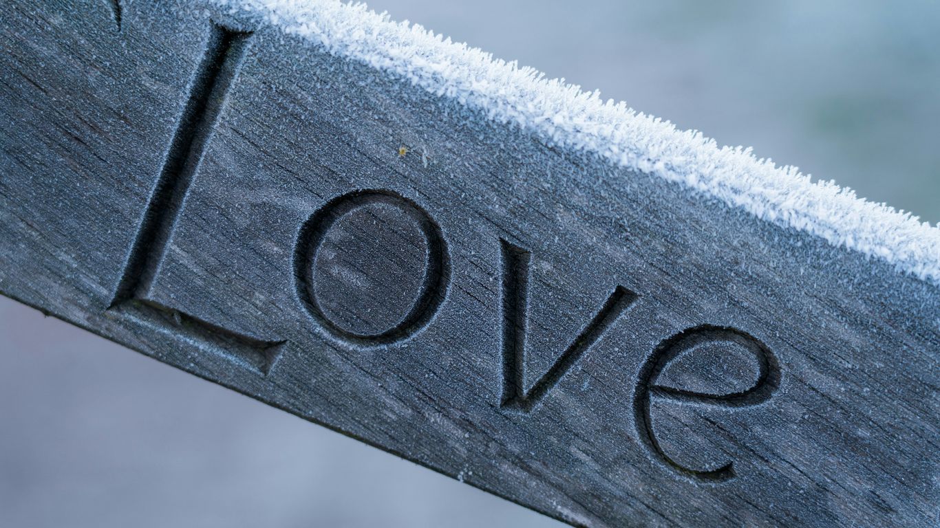 silver love embossed ornament on white textile