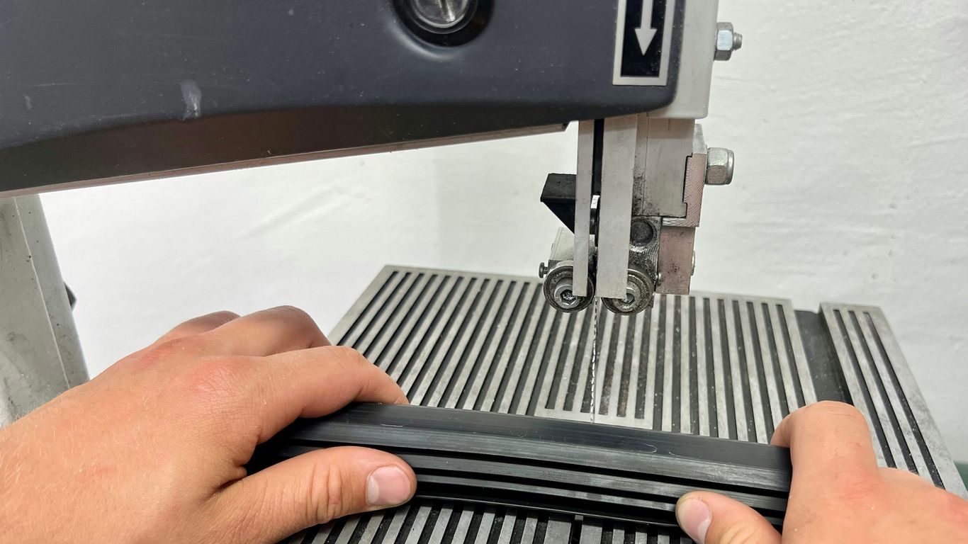 a person using a sewing machine to sew a piece of fabric