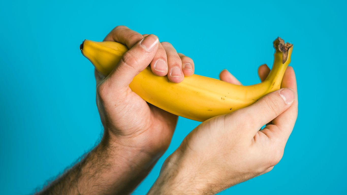 person holding banana