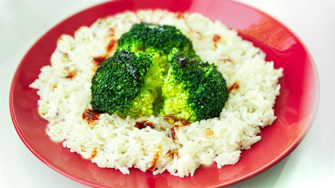 white rice with green broccoli on red plate