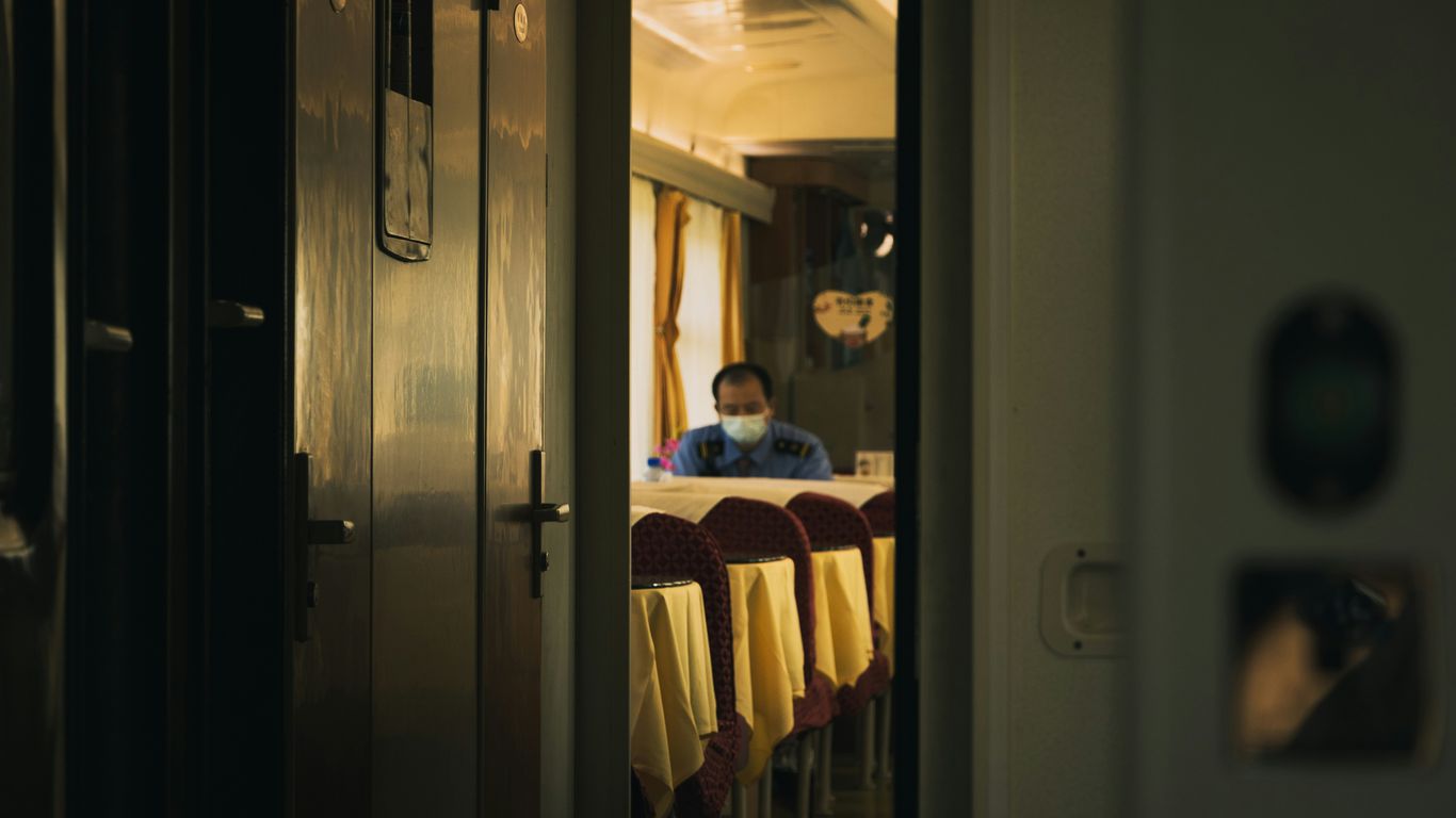 a man sitting at a table in a room