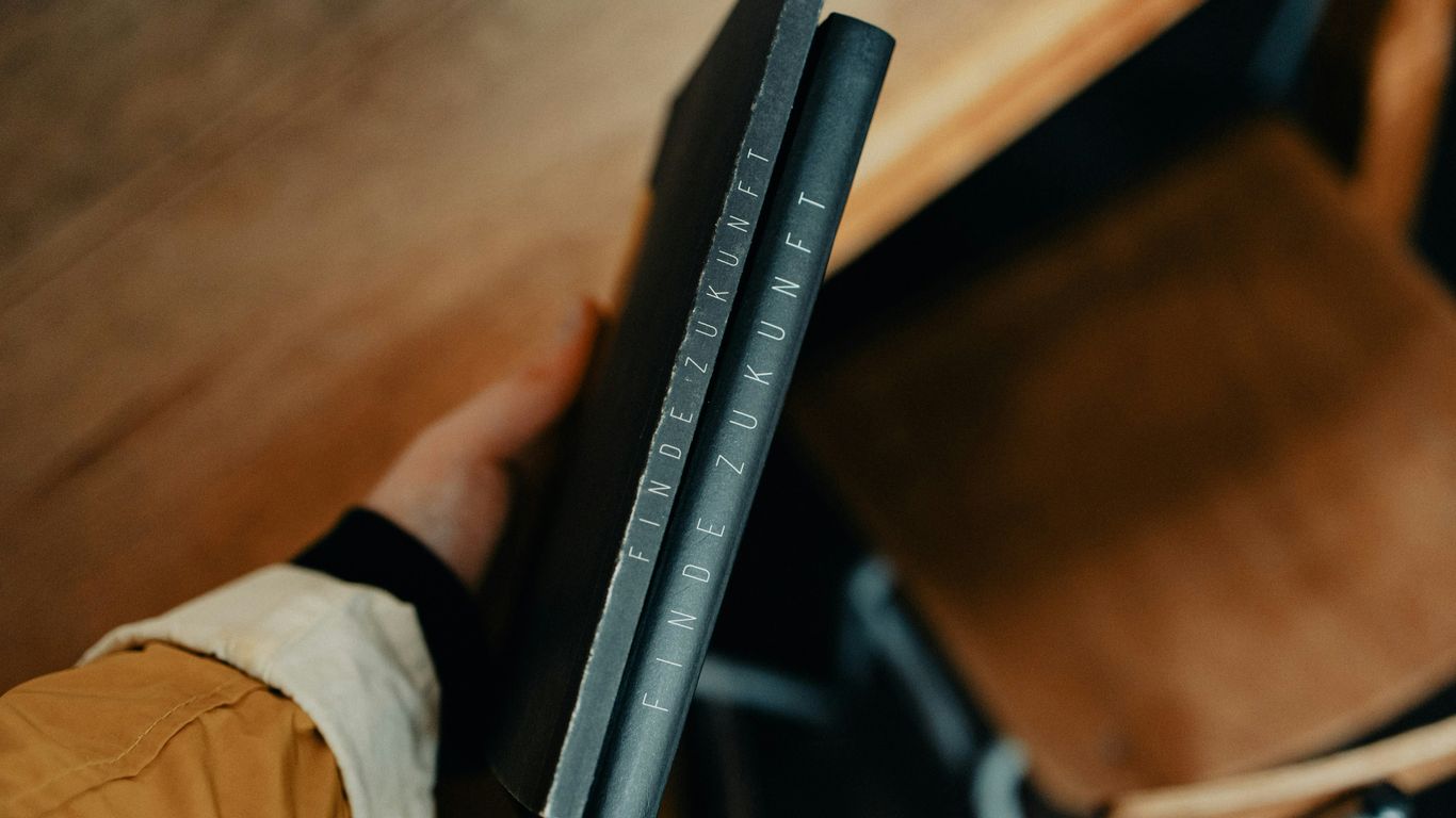 a person holding a book in their hand