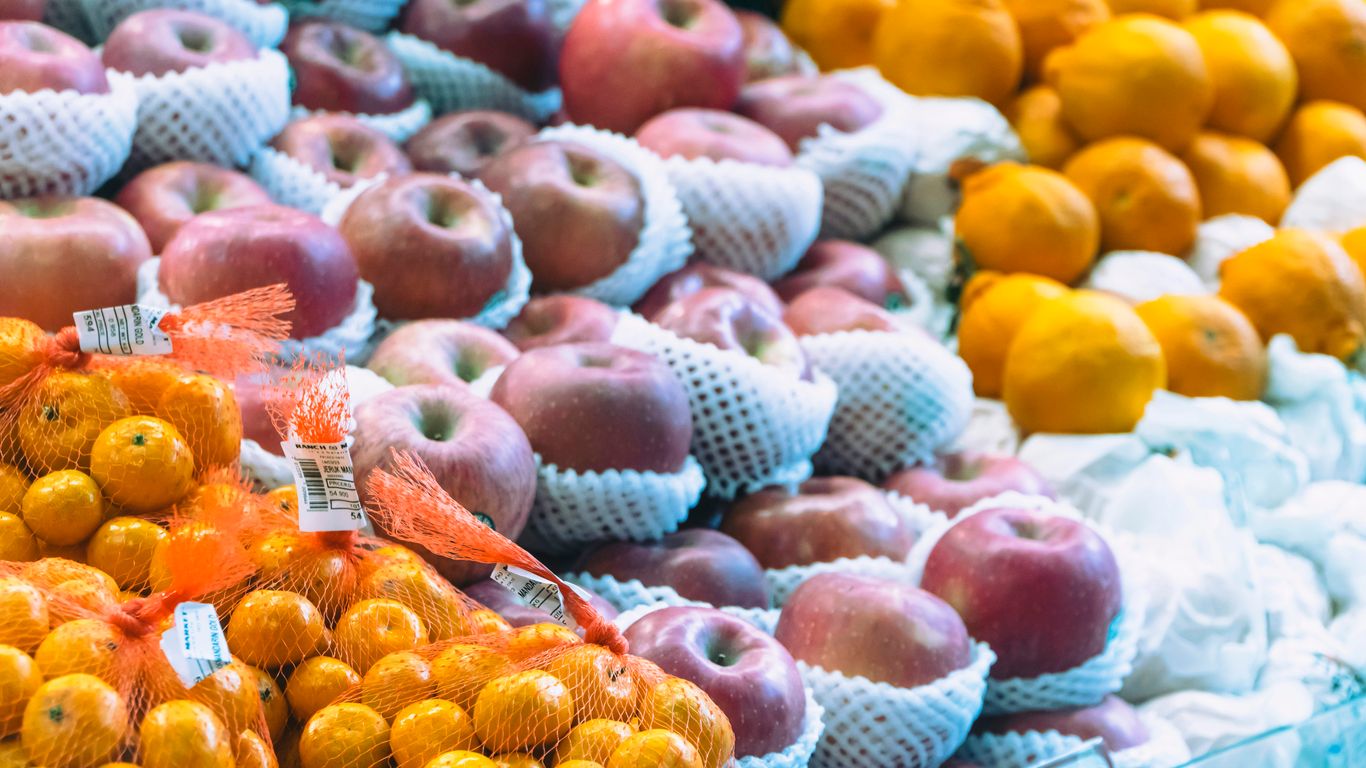 a display of apples, oranges, and other fruits