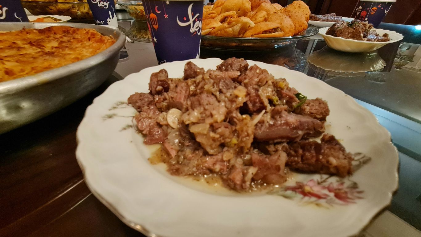 a plate full of food sitting on a table