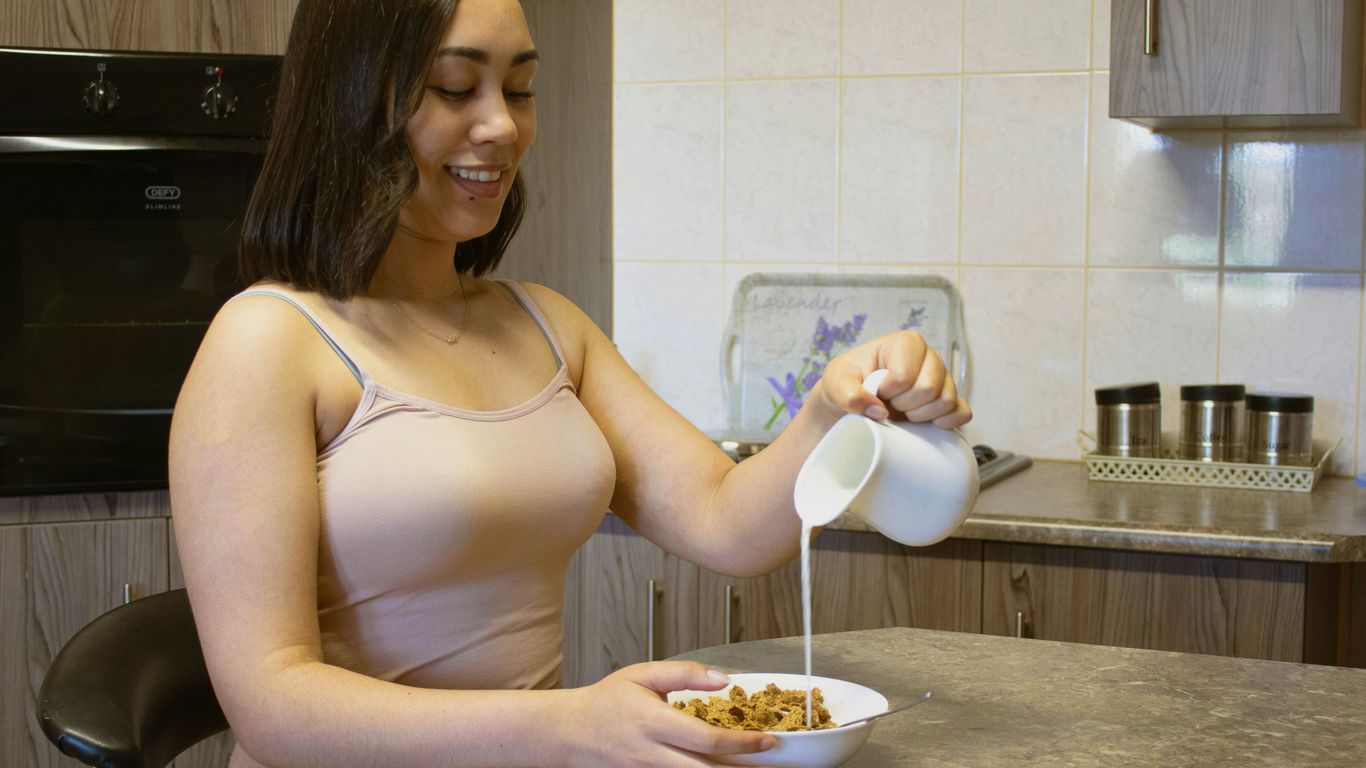 a woman eating cereal