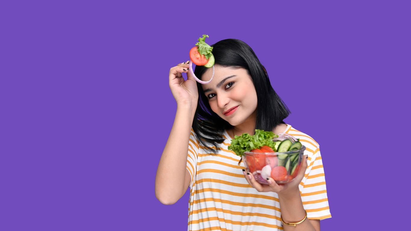 a person holding a bowl of fruit