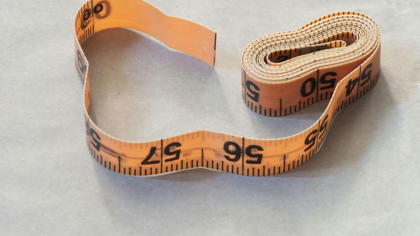 brown leather strap on white table