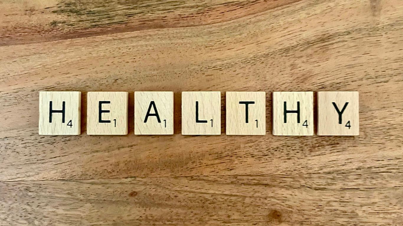 a group of white boxes with black text on a wooden surface