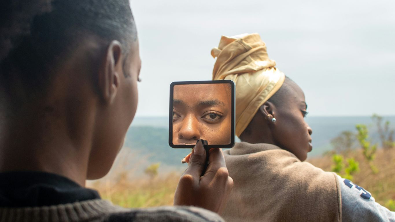 A woman taking a picture of herself in a mirror