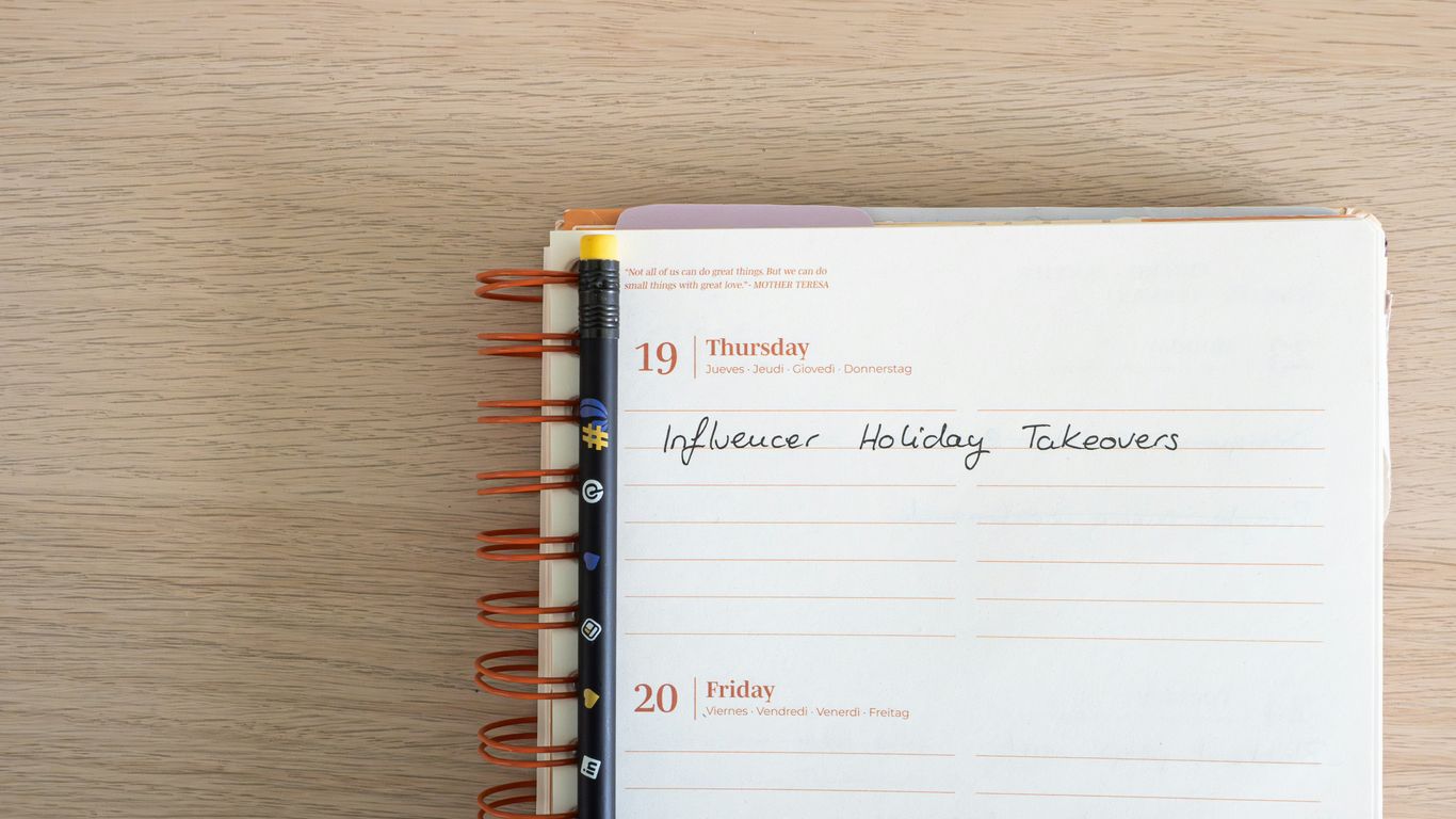 a notepad with writing on it sitting on top of a wooden table
